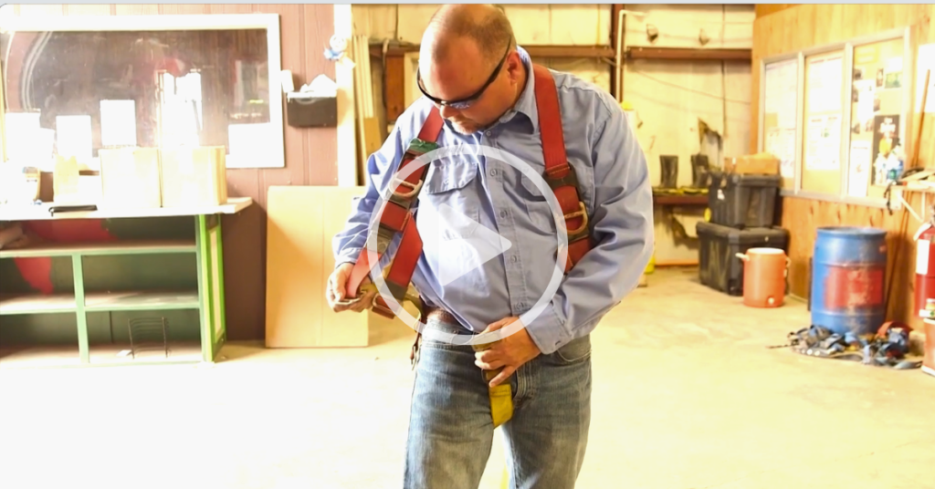 fall prevention and protection safety video man putting on fall protection harness